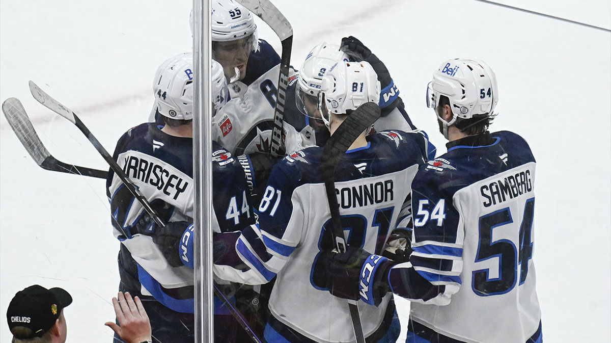 Winnipeg Jets left wing Kyle Connor (81) celebrates with teammates after scoring s goal sgsiumndst the Chicago Blackhawks during the second period at United Center.