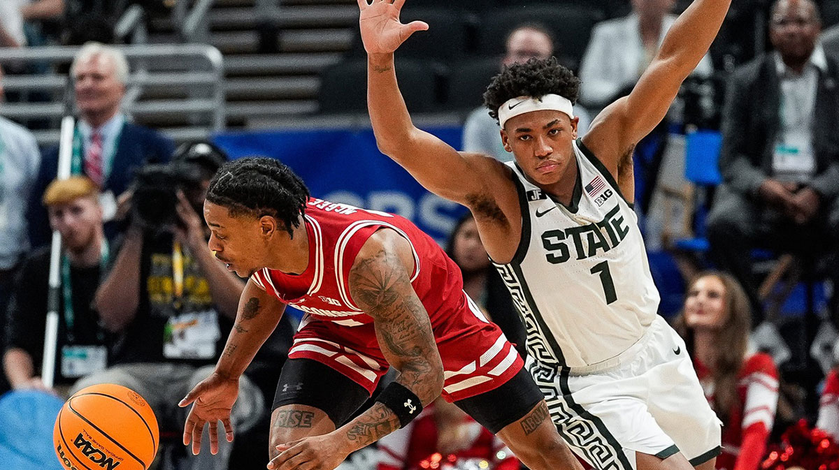 Michigan State guard Jeremy Fears Jr. (1) defends Wisconsin guard Kamari McGee (4) during the second half of Big Ten Tournament semifinal at Gainbridge Fieldhouse in Indianapolis, Ind. on Saturday, March 15, 2025.