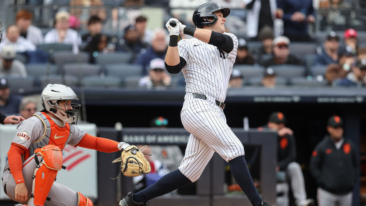 ; New York Yankees designated hitter Ben Rice (22) hits an RBI single in the second inning against the San Francisco Giants at Yankee Stadium.