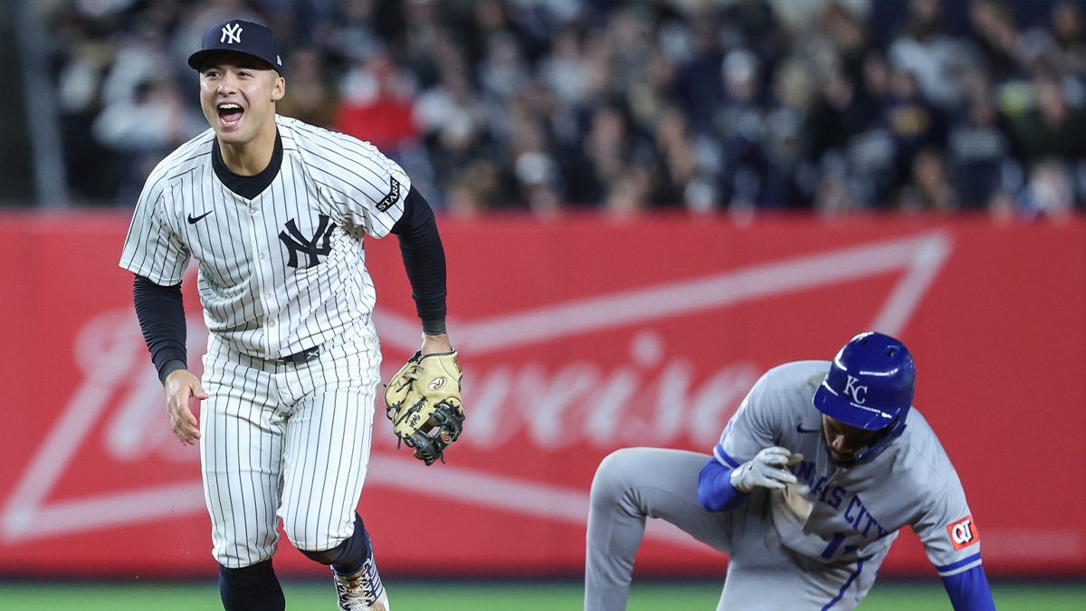 New York Yankees shortstop Anthony Volpe (11) celebrates after tagging out Kansas City Royals designated hitter Maikel Garcia (11) attempting to steal in the sixth inning at Yankee Stadium.