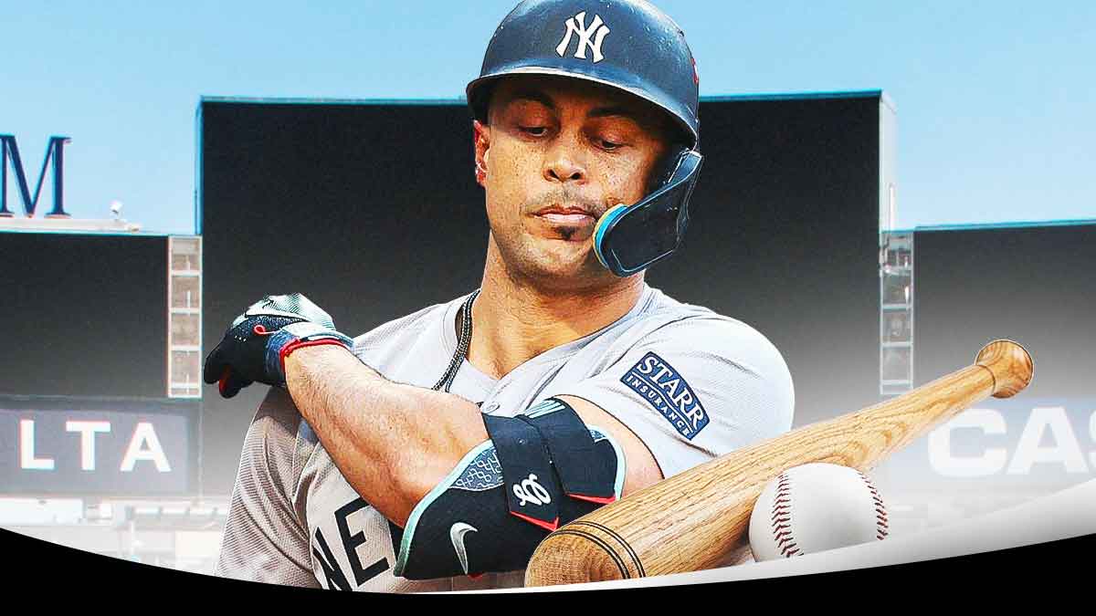 Yankees Giancarlo Stanton next to baseball bat