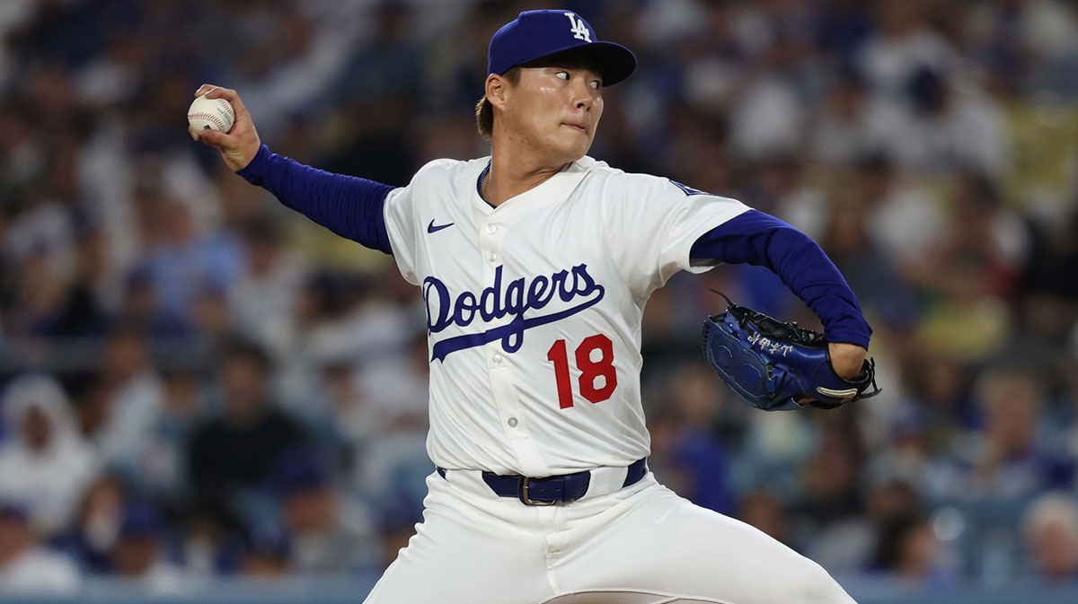 Los Angeles Dodgers pitcher Yoshinobu Yamamoto (18) throws during the third inning against the Chicago Cubs at Dodger Stadium.