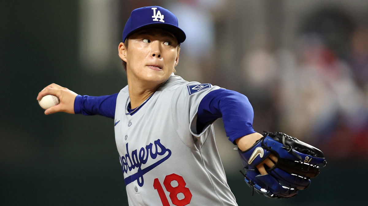 Los Angeles Dodgers pitcher Yoshinobu Yamamoto (18) throws a pitch during the first inning against the Texas Rangers at Globe Life Field.