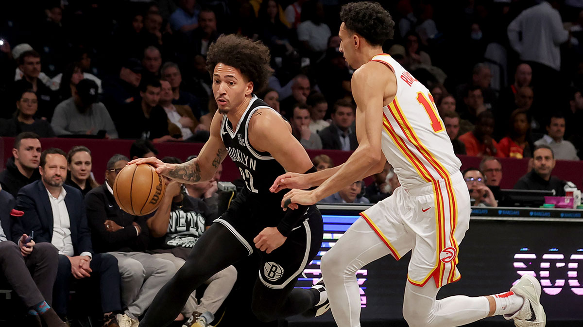 Brooklyn Nets forward Jalen Wilson (22) brings the ball up court against Atlanta Hawks forward Zaccharie Risacher (10) during the second quarter at Barclays Center.