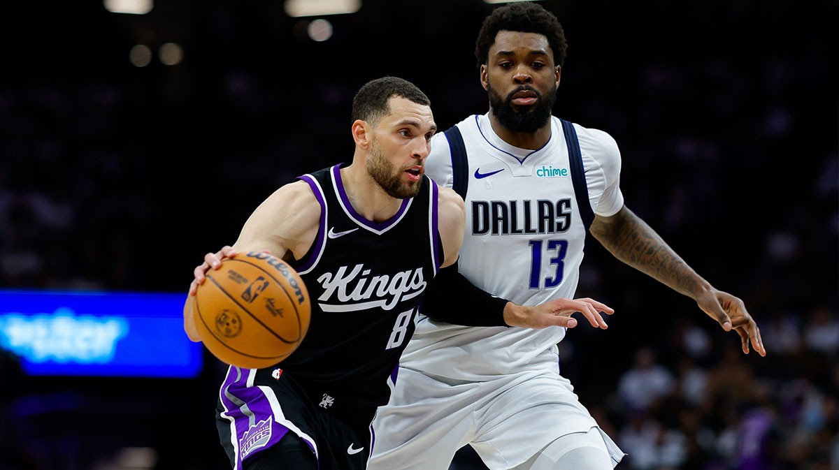 Sacramento Kings guard Zach LaVine (8) dribbles the ball against Dallas Mavericks forward Naji Marshall (13) during the fourth quarter at Golden 1 Center.