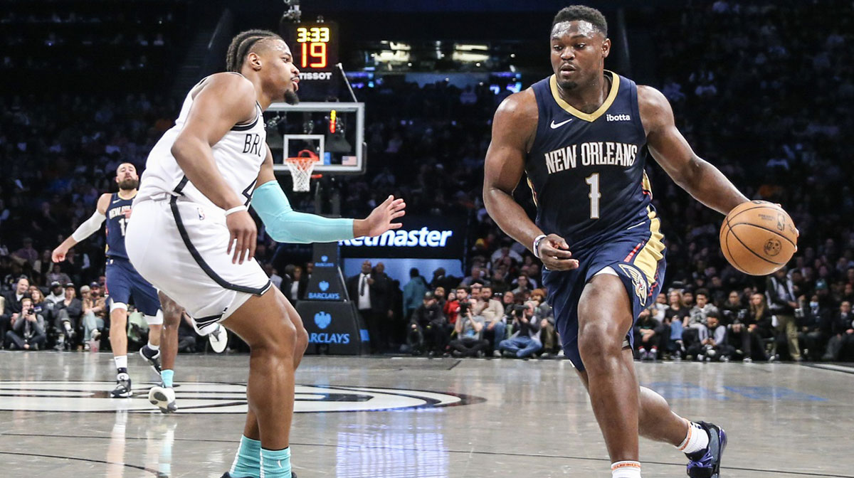 New Orleans Pelicans forward Zion Williamson (1) looks to drive past Brooklyn Nets guard Dennis Smith Jr. (4) in the second quarter at Barclays Center.