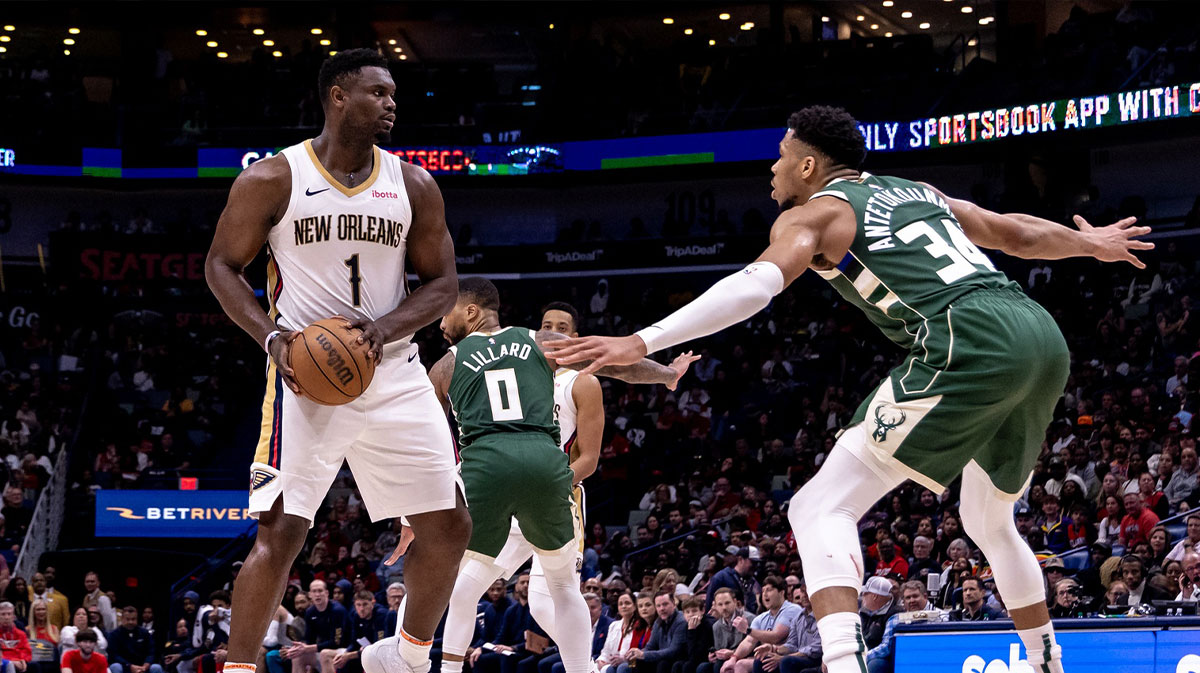 New Orleans Pelicans forward Zion Williamson (1) looks to pass the ball against Milwaukee Bucks forward Giannis Antetokounmpo (34) during the second half at Smoothie King Center.