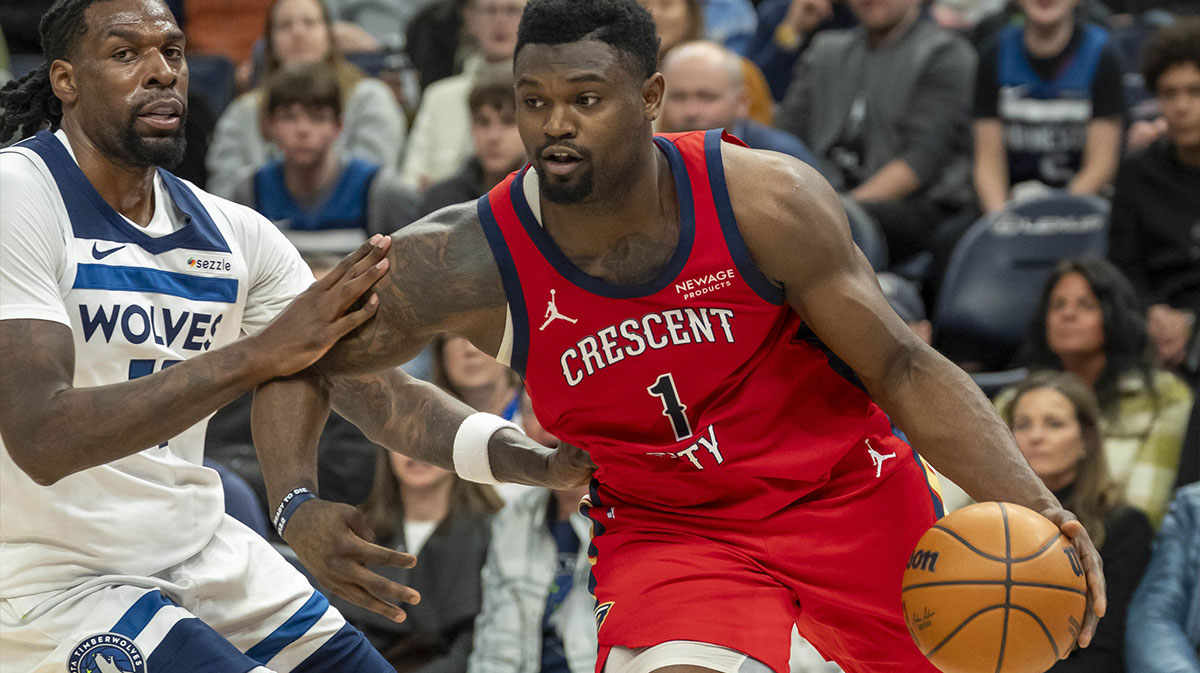 New Orleans Pelicans forward Zion Williamson (1) drives to the basket past Minnesota Timberwolves center Naz Reid (11) in the second half at Target Center.