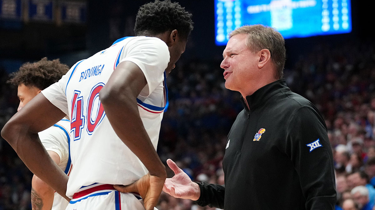 Kansas Jayhawks head coach Bill Self talks with forward Flory Bidunga (40) during a time out against the Houston Cougars during the first half at Allen Fieldhouse.