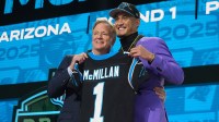 NFL Commissoner Rodger Goodell, left, with Arizona Wildcats wide receiver Tetairoa McMillan selected by the Carolina Panthers as the number eight pick in the first round of the 2025 NFL Draft at Lambeau Field.