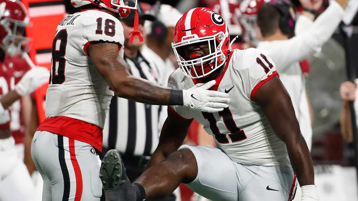 Georgia linebacker Jalon Walker (11) celebrates after sacking Alabama quarterback Jalen Milroe (4) during the first half of the SEC Championship game against Alabama.