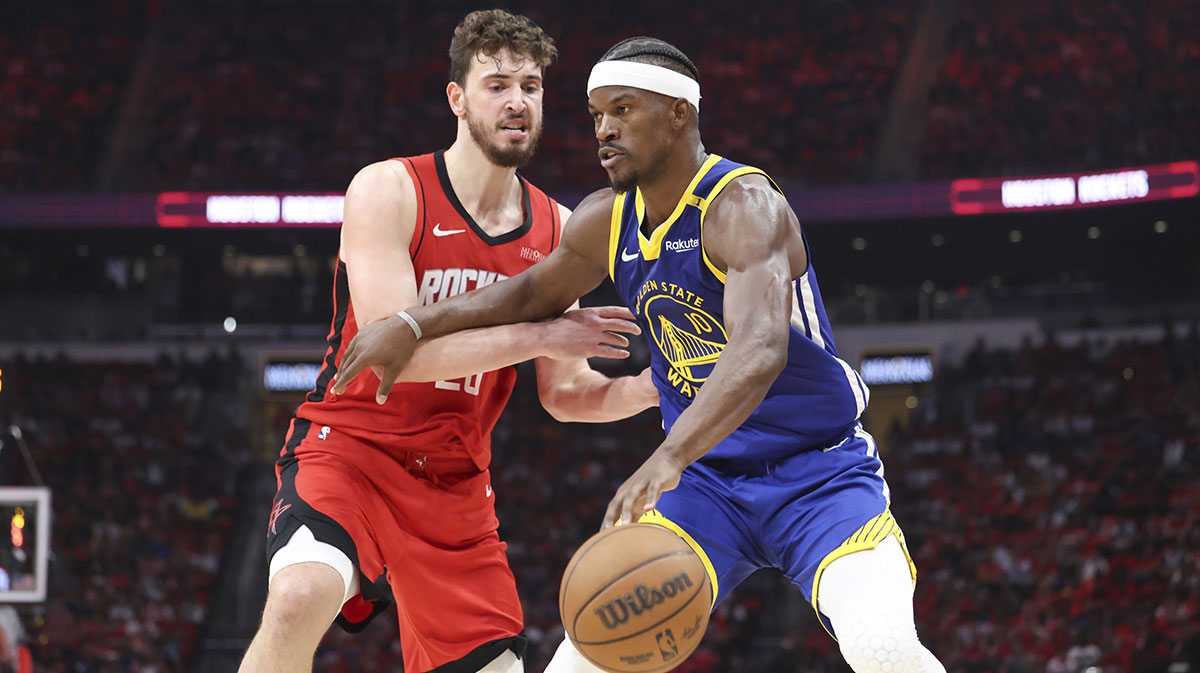 Golden State Warriors forward Jimmy Butler III (10) controls the ball as Houston Rockets center Alperen Sengun (28) defends during the second quarter at Toyota Center.