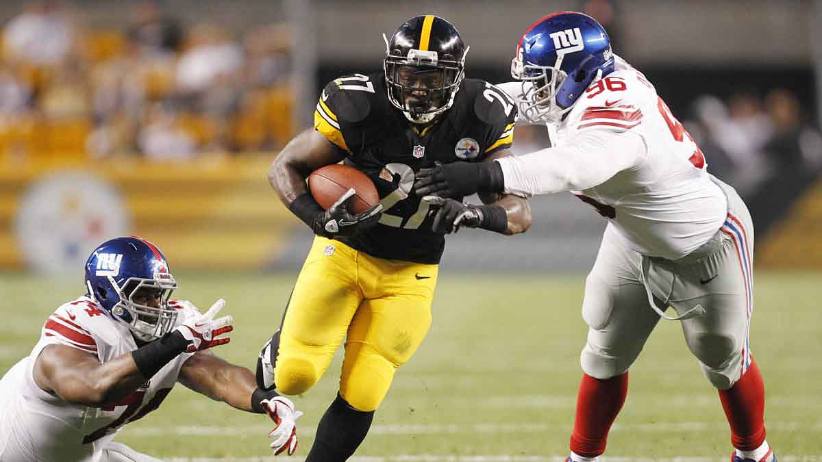 Pittsburgh Steelers running back Jonathan Dwyer (27) carries the ball as New York Giants defensive tackle Johnathan Hankins (74) and defensive tackle Marvin Austin (96) defend during the second quarter at Heinz Field.