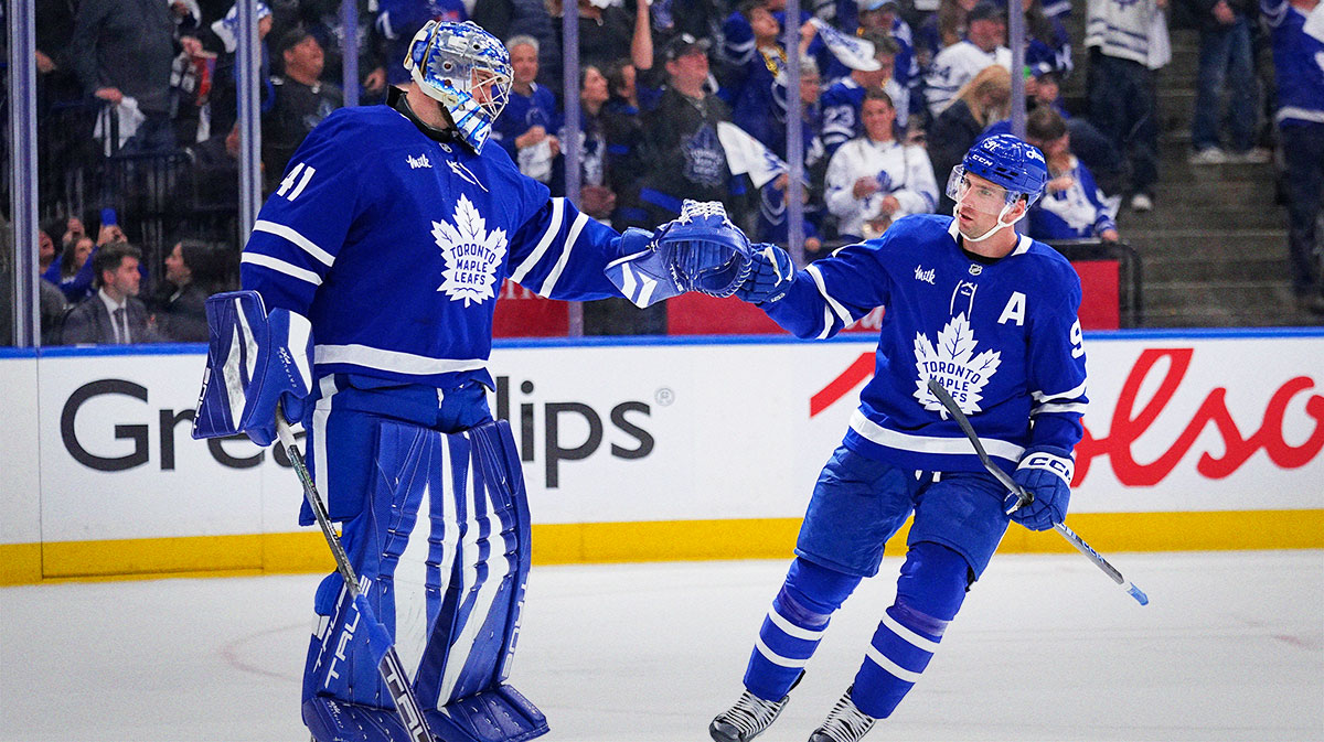 Toronto Maple Leafs forward John Tavares (91) celebrates his goal against the Ottawa Senators with Toronto Maple Leafs goaltender Anthony Stolarz (41) during the second period of game one of the first round of the 2025 Stanley Cup Playoffs at Scotiabank Arena.