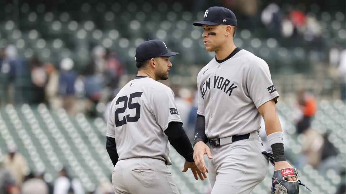 New York Yankees catcher J.C. Escarra (25) and outfielder Aaron Judge (99) celebrate after defeating the Detroit Tigers at Comerica Park.