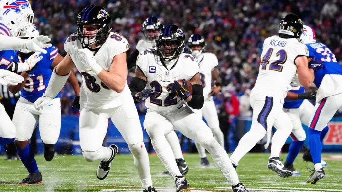 Baltimore Ravens running back Derrick Henry (22) runs the ball during the third quarter against the Buffalo Bills in a 2025 AFC divisional round game at Highmark Stadium.