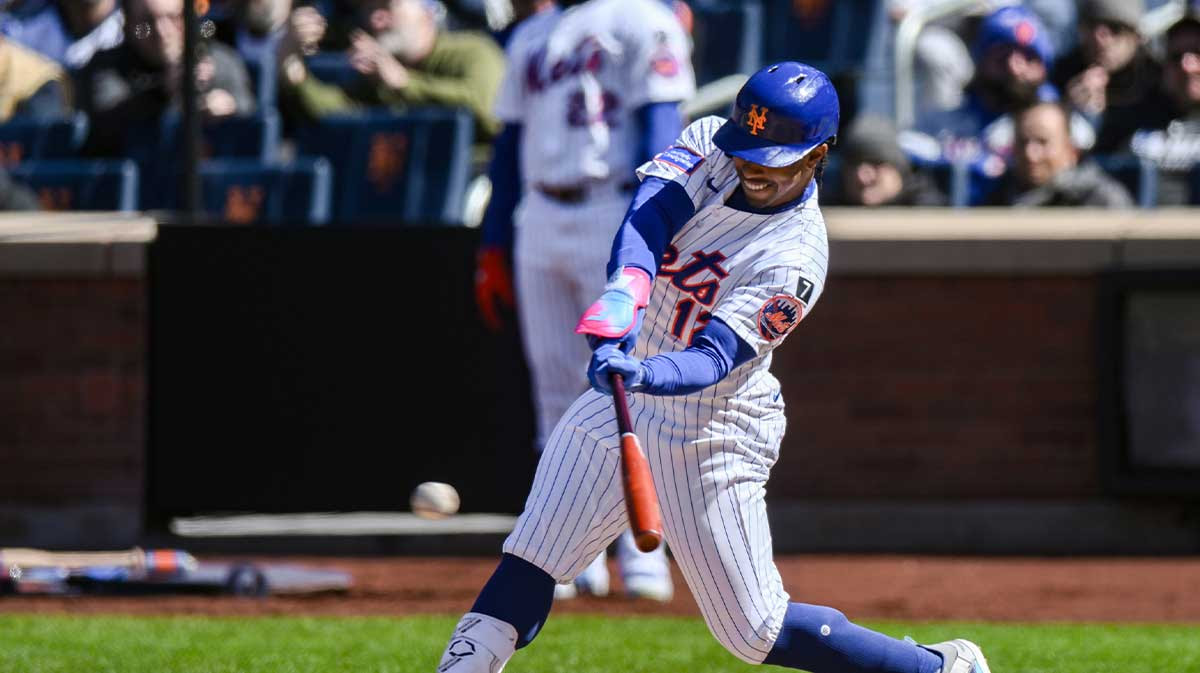 New York Mets shortstop Francisco Lindor (12) hits a single against the Miami Marlins during the sixth inning at Citi Field.