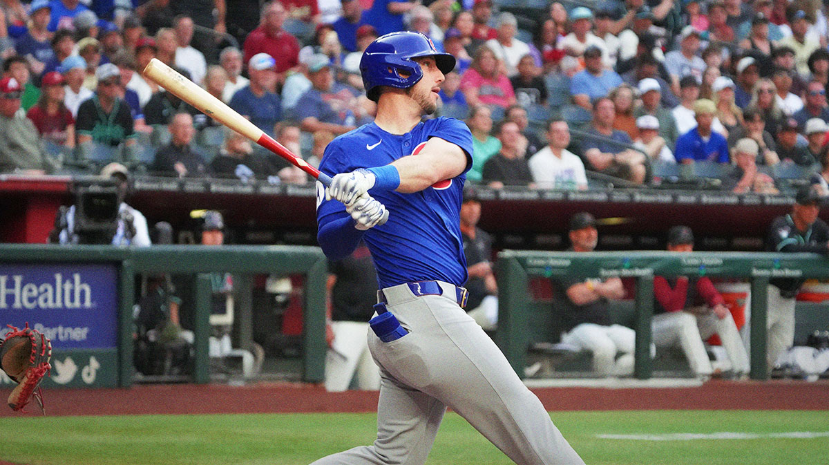 Chicago Cubs outfielder Kyle Tucker (30) hits a double against the Arizona Diamondbacks in the first inning at Chase Field.