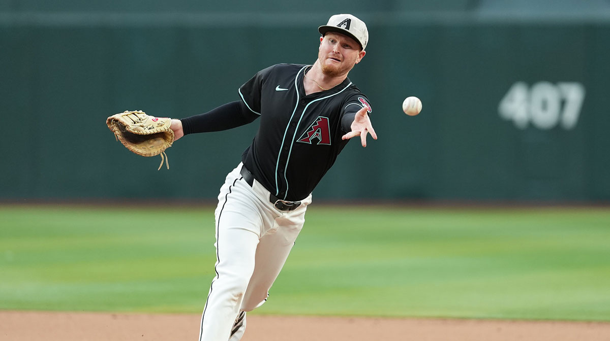 Arizona Diamondbacks first baseman Pavin Smith (26) throws to first to force an out against the Colorado Rockies in the fifth inning at Chase Field.