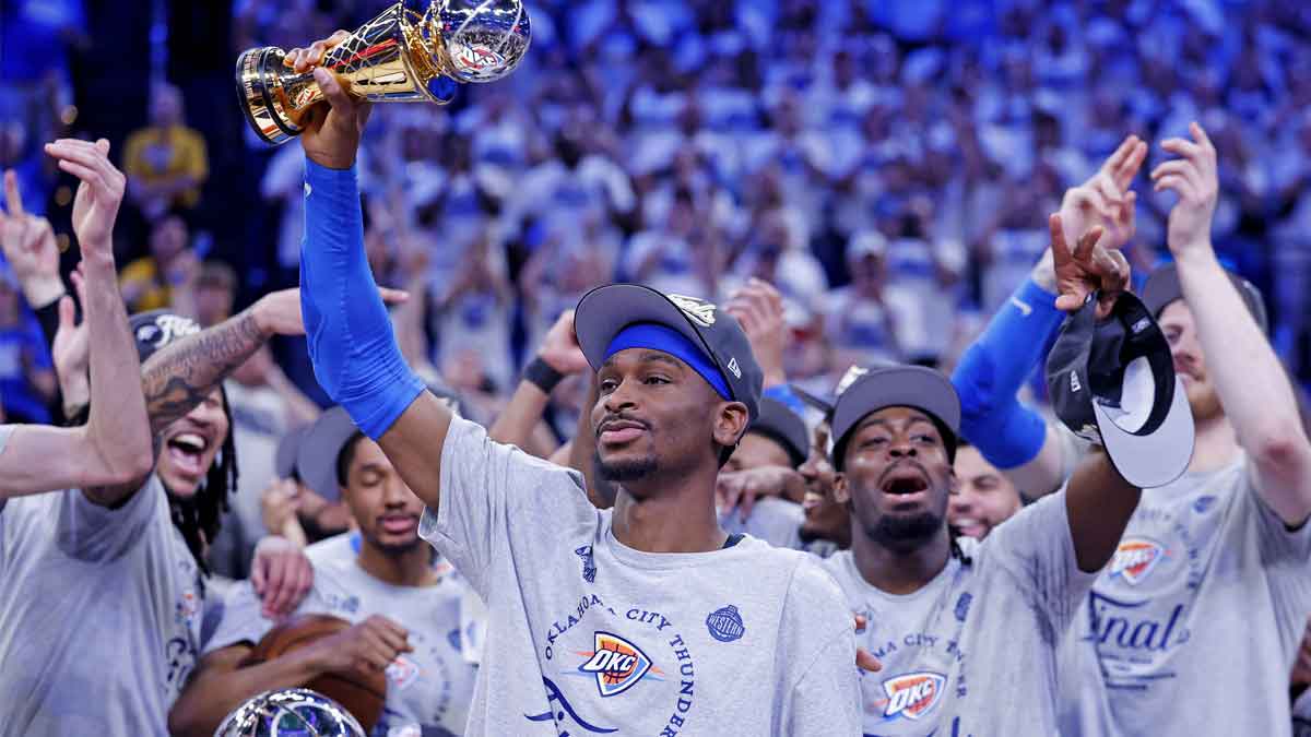 Oklahoma City Thunder guard Shai Gilgeous-Alexander (2) celebrates with Magic Johnson West Conference Finals MVP trophy after defeating the Minnesota Timberwolves in game five to win the western conference finals for the 2025 NBA Playoffs at Paycom Center.
