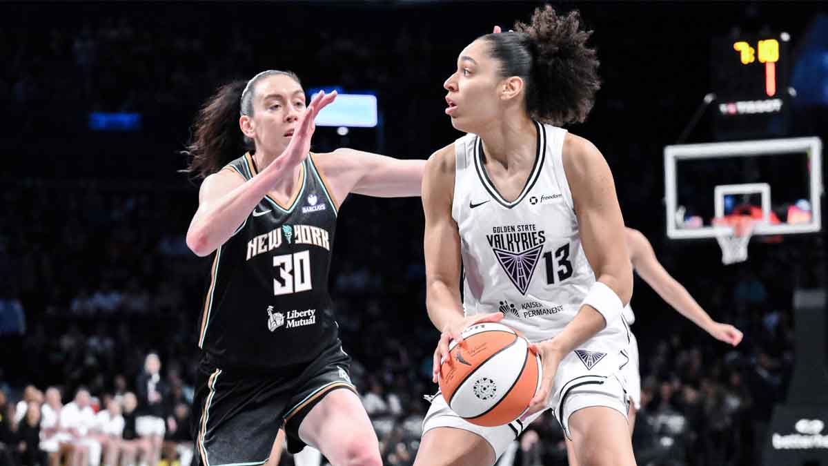 Golden State Valkyries forward Janelle Salaun (13) looks to pass the ball as New York Liberty forward Breanna Stewart (30) defends during the first half at Barclays Center.