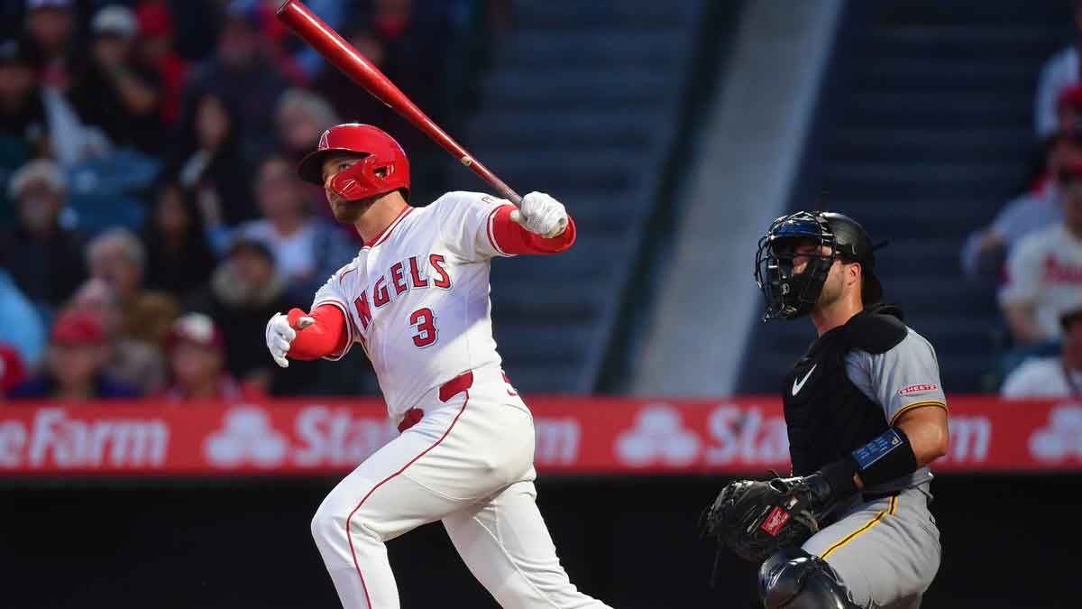 Los Angeles Angels left fielder Taylor Ward (3) hits a solo home run against the Pittsburgh Pirates during the third inning at Angel Stadium.