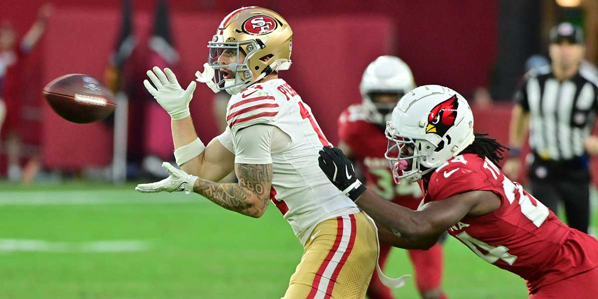 San Francisco 49ers wide receiver Ricky Pearsall (14) catches a pass as Arizona Cardinals cornerback Starling Thomas V (24) defends in the second half at State Farm Stadium.