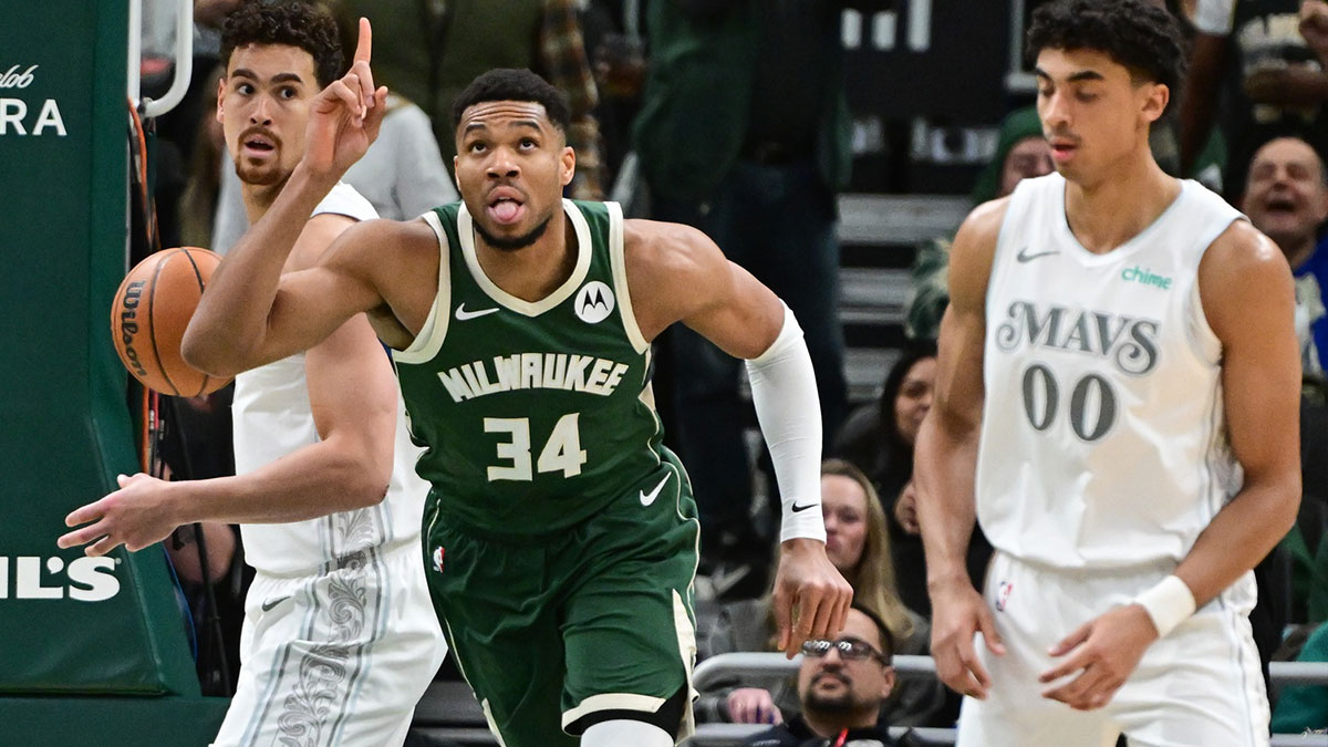 Milwaukee Bucks forward Giannis Antetokounmpo (34) reacts after scoring his 20,000th career point in the third quarter against the Dallas Mavericks at Fiserv Forum.
