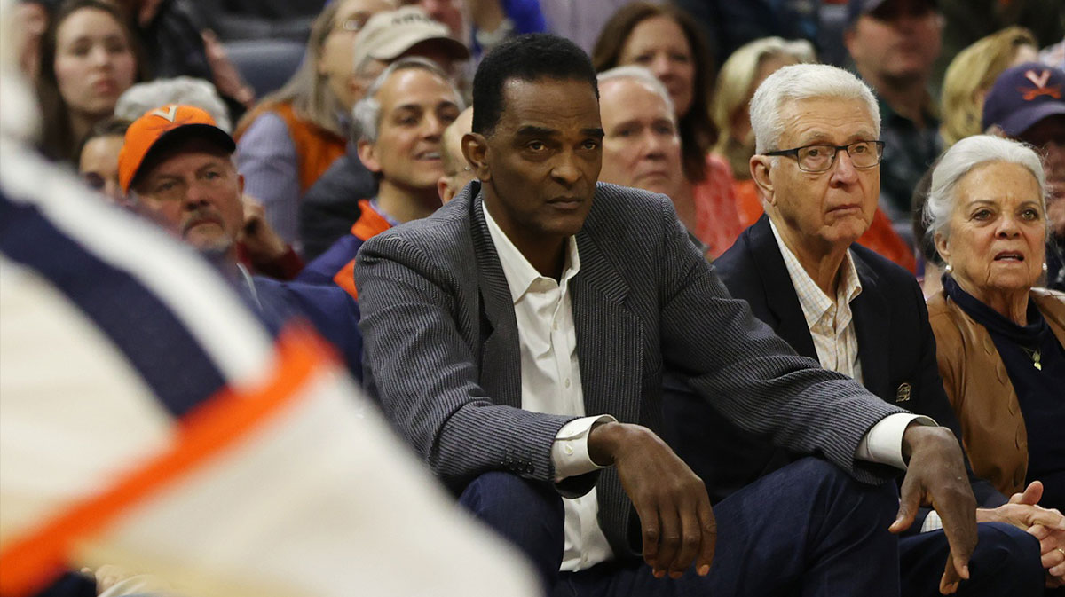 Former Virginia Cavaliers player Ralph Sampson (L) and former Cavaliers head coach Terry Holland (R) watch courtside against the Duke Blue Devils in the first half at John Paul Jones Arena.