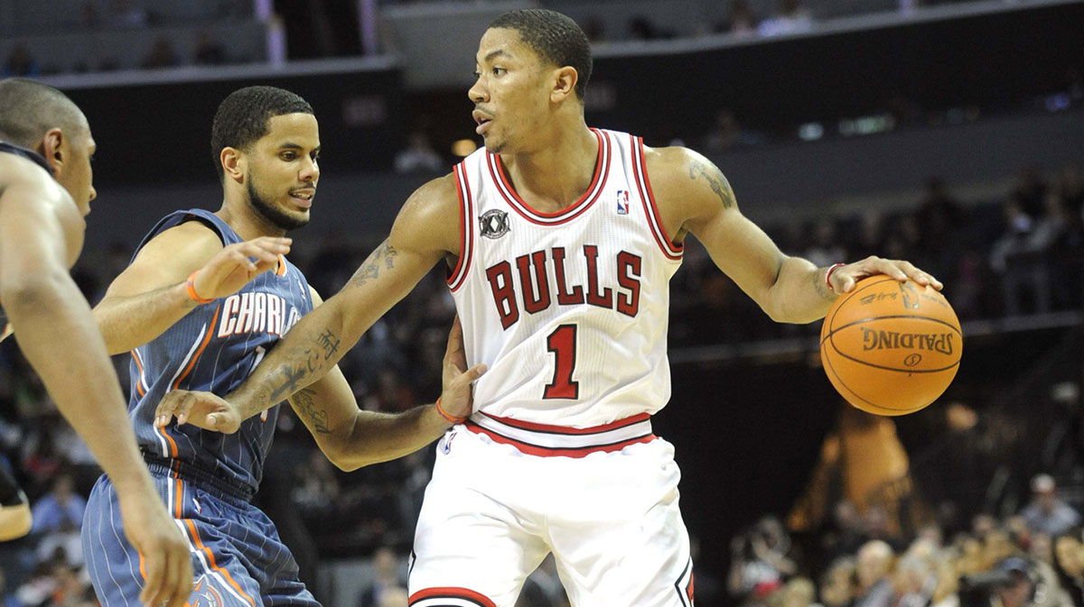 Chicago Bulls guard Derrick Rose (1) prepares to drive past Charlotte Bobcats guard D.J. Augustin (14) at Time Warner Cable Arena. Bulls win 101-84.
