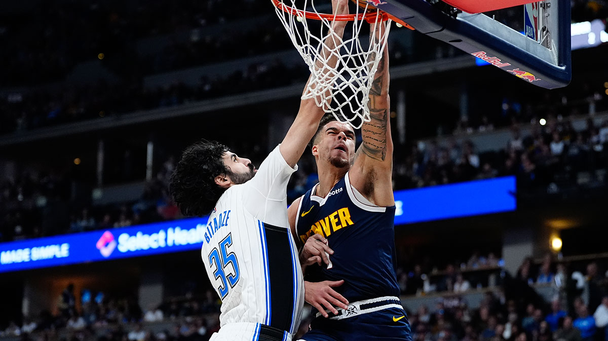 Orlando Magic center Goga Bitadze (35) blocks a shot by Denver Nuggets forward Michael Porter Jr. (1) in the second quarter at Ball Arena.