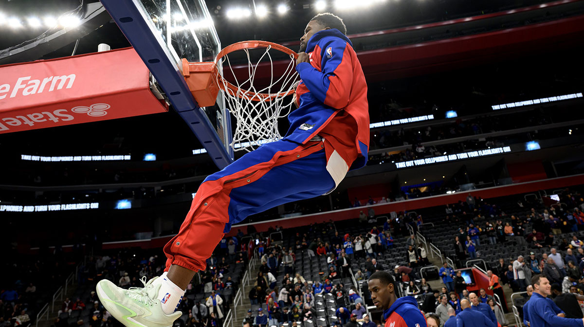 Detroit Pistons guard Malik Beasley (5) does pull ups on the rim before their game against the Portland Trail Blazers at Little Caesars Arena.