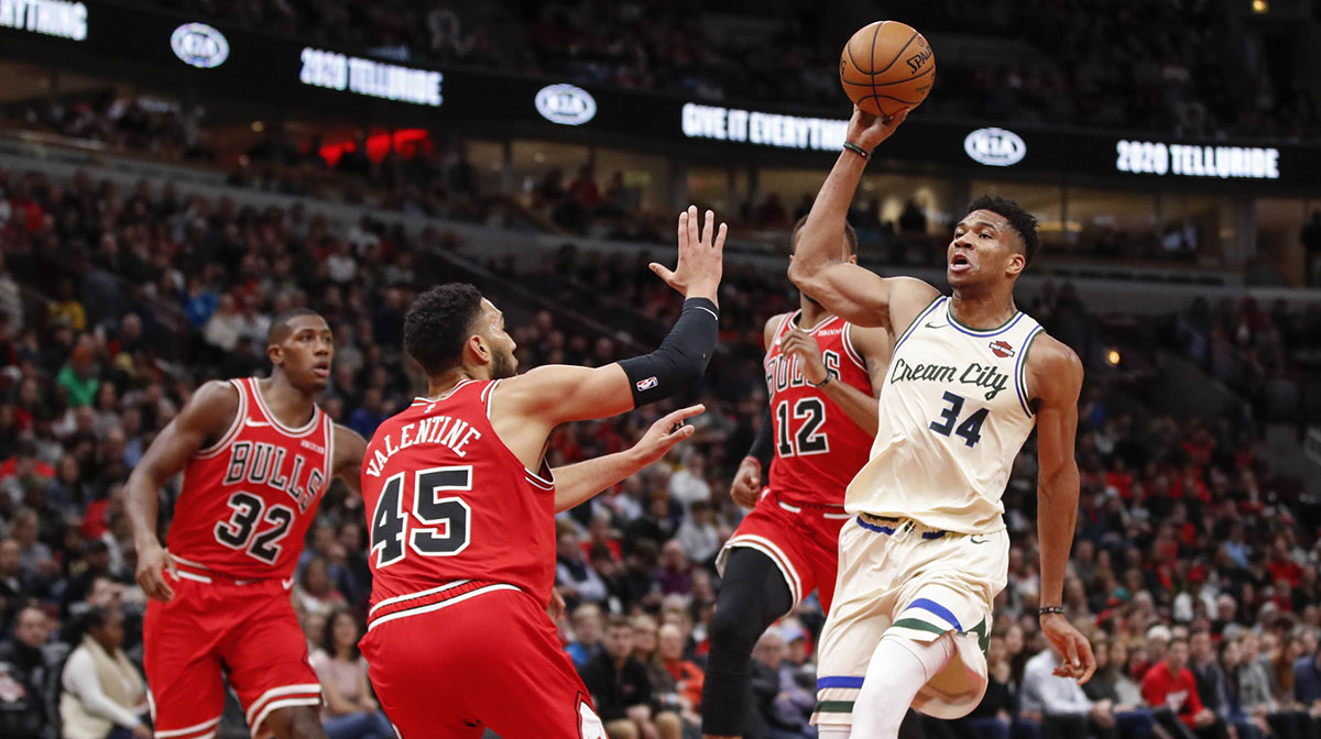 Milwaukee Bucks forward Giannis Antetokounmpo (34) drives to the basket against Chicago Bulls guard Denzel Valentine (45) during the first half at United Center.