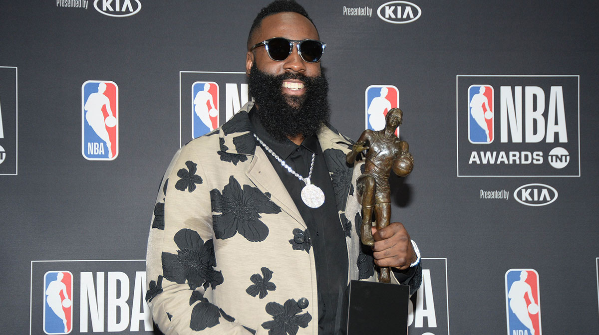 Houston Rockets guard James Harden poses for photos with his MVP award during the NBA Award Show at Barker Hanger.