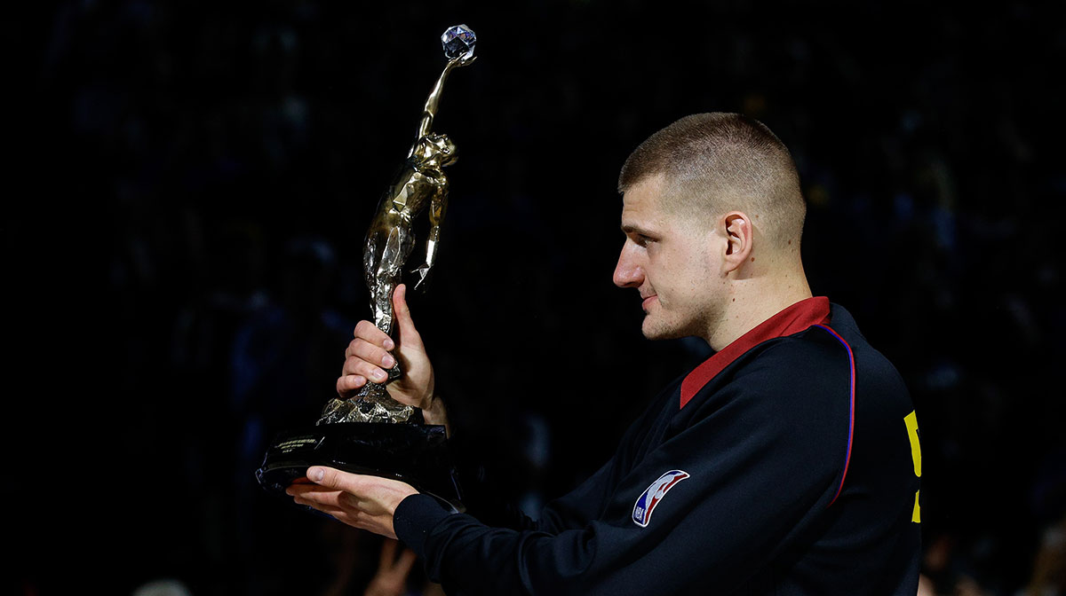 Denver Nuggets center Nikola Jokic (15) gestures with the KIA NBA MVP trophy to his teammates before game five against the Minnesota Timberwolves in the second round for the 2024 NBA playoffs at Ball Arena.