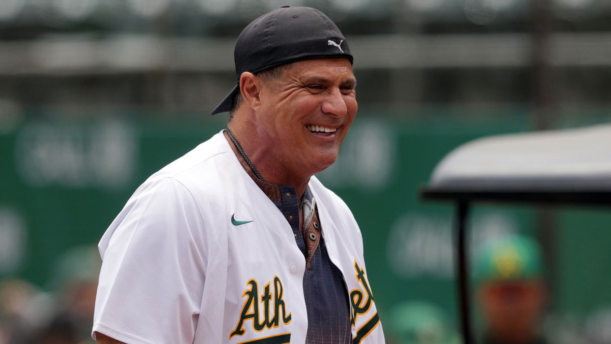 Oakland Athletics former outfielder Jose Canseco stands on the field before the game against the Los Angeles Angels at Oakland-Alameda County Coliseum.
