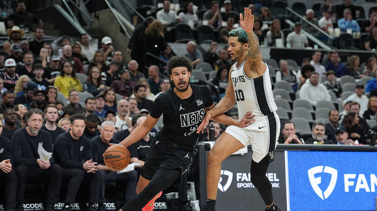 Brooklyn Nets forward Cameron Johnson (2) dribbles past San Antonio Spurs forward Jeremy Sochan (10) in the second half at Frost Bank Center.