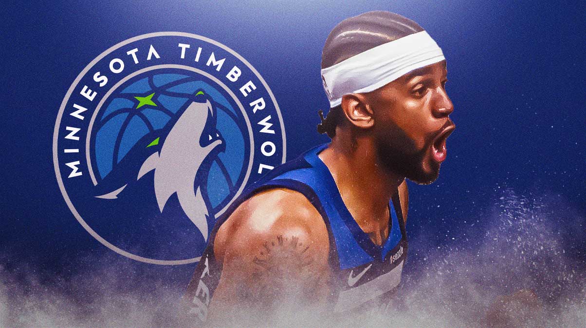 Nickeil Alexander-Walker playing for Timberwolves with Timberwolves logo in background.