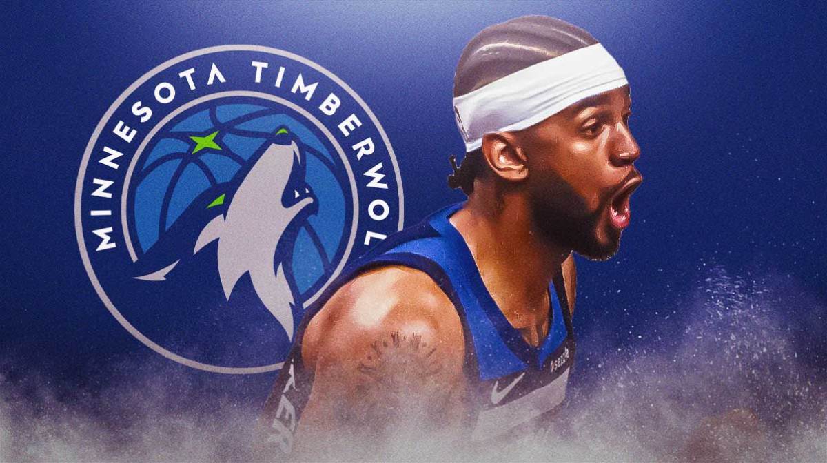 Nickeil Alexander-Walker playing for Timberwolves with Timberwolves logo in background.