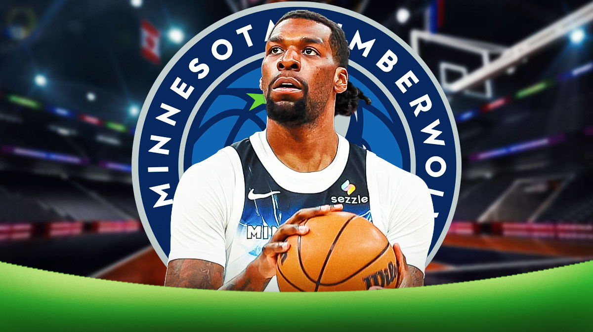 Naz Reid playing for Timberwolves with T-Wolves logo in background.