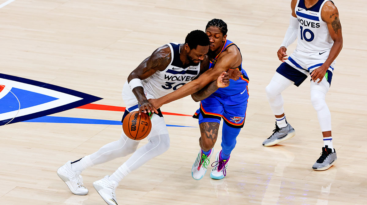 Minnesota Timberwolves forward Julius Randle (30) drives to the basket against Oklahoma City Thunder guard Luguentz Dort (5) during the third quarter in game five of the western conference finals for the 2025 NBA Playoffs at Paycom Center.