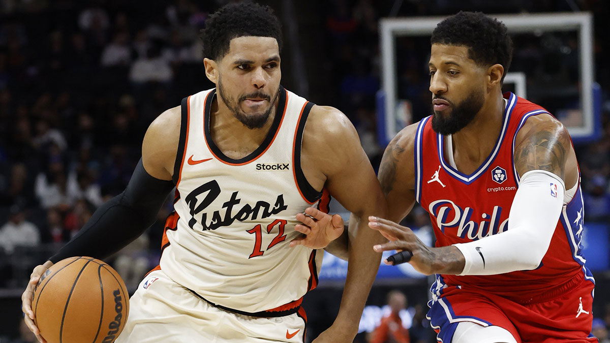 Detroit Pistons forward Tobias Harris (12) dribbles defended by Philadelphia 76ers forward Paul George (8) in the second half at Little Caesars Arena.
