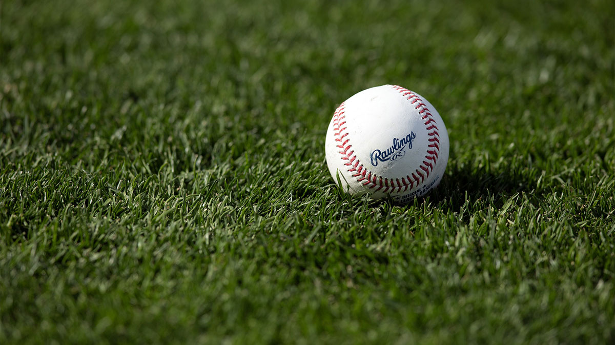 A Major League Baseball sits on the turf before a game between the Athletics and San Francisco Giants the at Oracle Park.