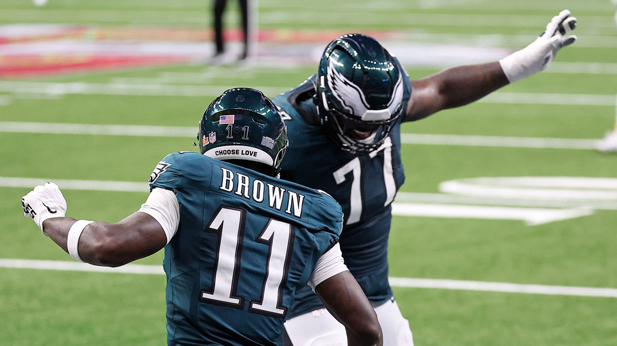 Philadelphia Eagles wide receiver A.J. Brown (11) celebrates with offensive tackle Mekhi Becton (77) after scoring a touchdown against the Kansas City Chiefs during the first half of Super Bowl LIX at Caesars Superdome.