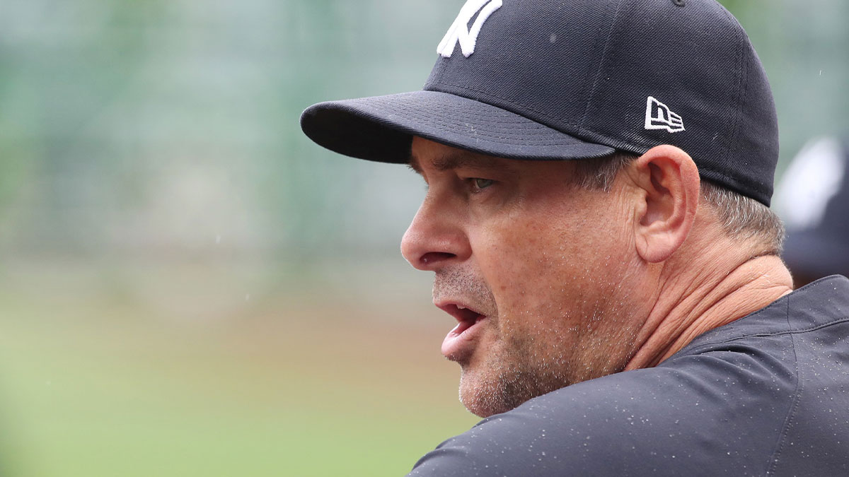 Yankees manager Aaron Boone (17) looks on from the dugout against the Pittsburgh Pirates during the first inning at PNC Park.