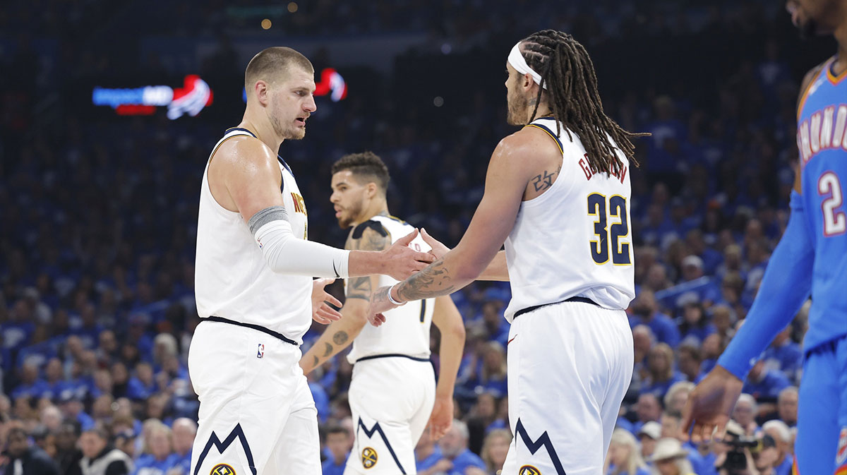 Denver Nuggets center Nikola Jokic (15) and Denver Nuggets forward Aaron Gordon (32) celebrate after a play against the Oklahoma City Thunder in the first quarter during game seven of the second round for the 2025 NBA Playoffs at Paycom Center.