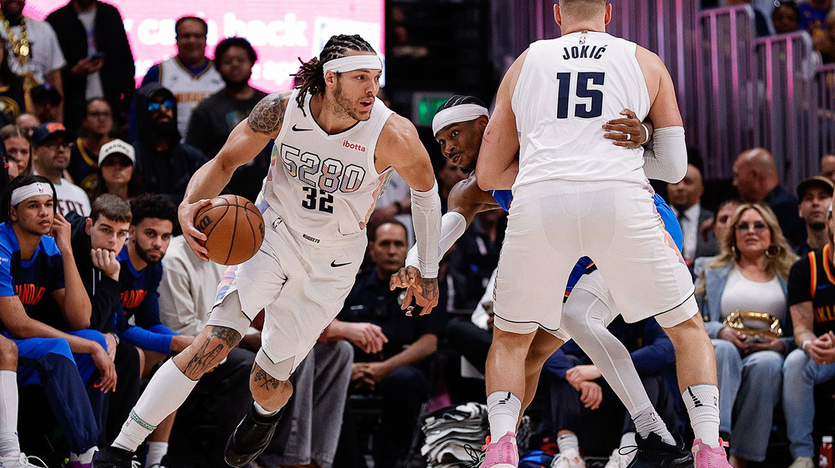 Denver Nuggets forward Aaron Gordon (32) controls the ball as center Nikola Jokic (15) screens against Oklahoma City Thunder guard Shai Gilgeous-Alexander (2) in the second quarter during game six of the second round for the 2025 NBA Playoffs at Ball Arena.