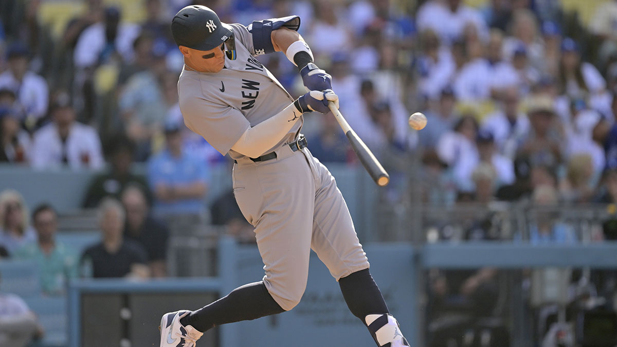 New York Yankees outfielder Aaron Judge (99) hits a solo home run in the fourth inning against the Los Angeles Dodgers at Dodger Stadium.