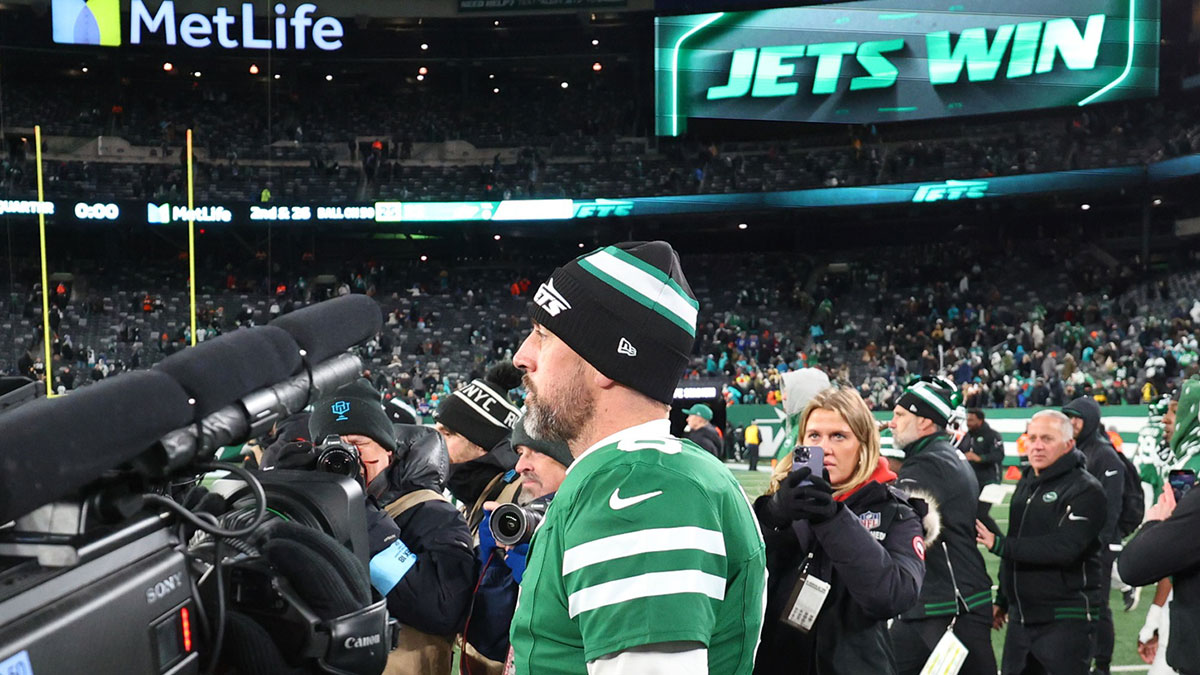 New York Jets quarterback Aaron Rodgers (8) walks on the field after the Jets win over the Miami Dolphins at MetLife Stadium