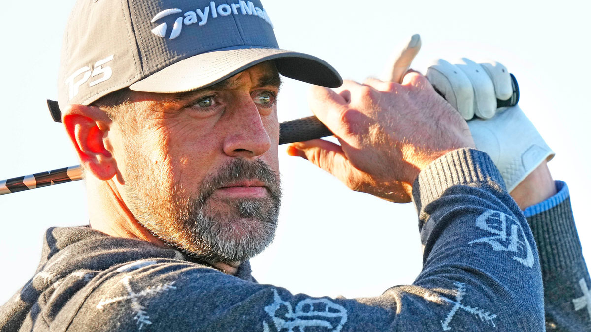 New York Jets quarterback Aaron Rodgers tees off on the first hole during the Phoenix Open Annexus Pro-Am at TPC Scottsdale.